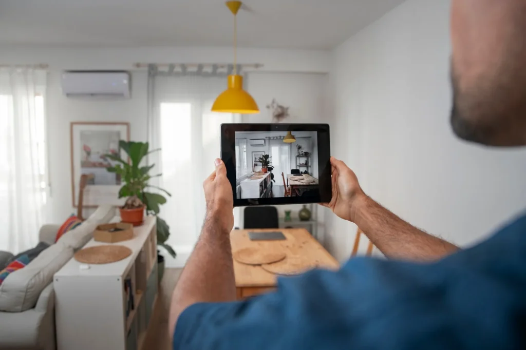 Homeowner monitoring nationwide AFTECHS-installed smart security system on a tablet — keeping family and property safe