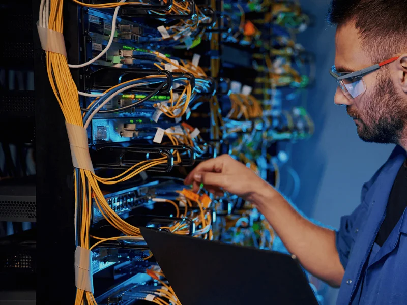 AFTECHS technician labeling network cables during commercial structured cabling and network infrastructure installation